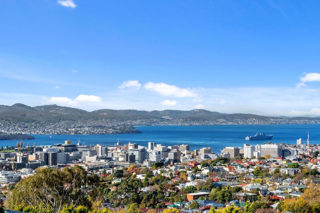 an aerial view of a city and the ocean at Hobart Vista in Hobart