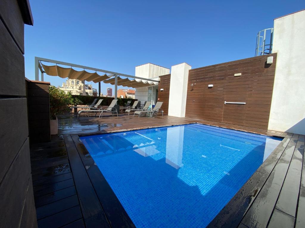 a swimming pool on top of a building at Chi in Barcelona