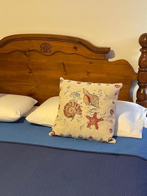 Postel nebo postele na pokoji v ubytování La Villa Carmela Cuma