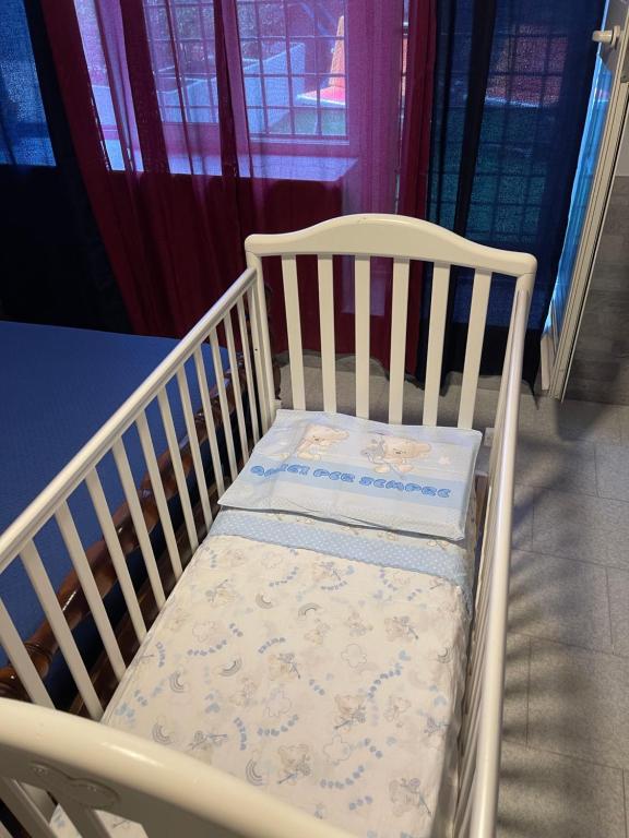 Postel nebo postele na pokoji v ubytování La Villa Carmela Cuma