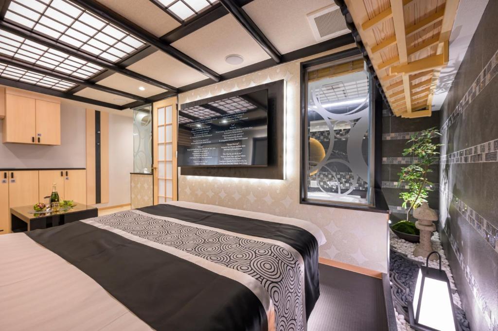 Postel nebo postele na pokoji v ubytování Hotel P'sResort Adults only 大人専用