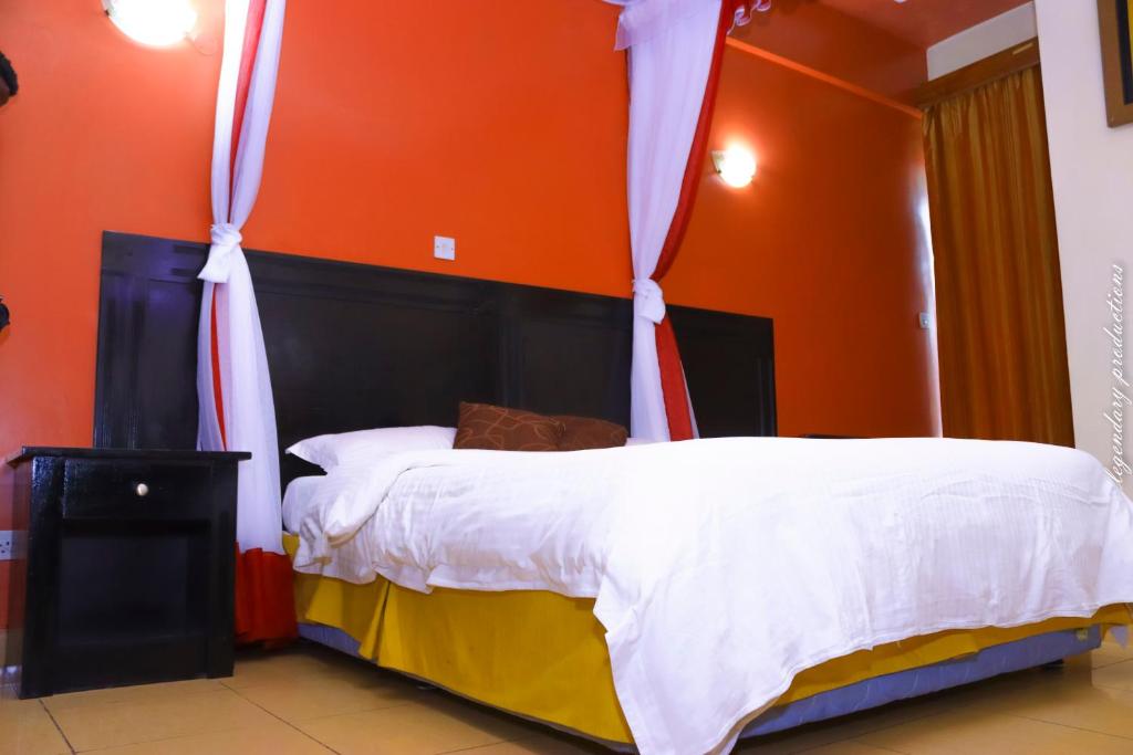 Postel nebo postele na pokoji v ubytování Jamia Central Hotel