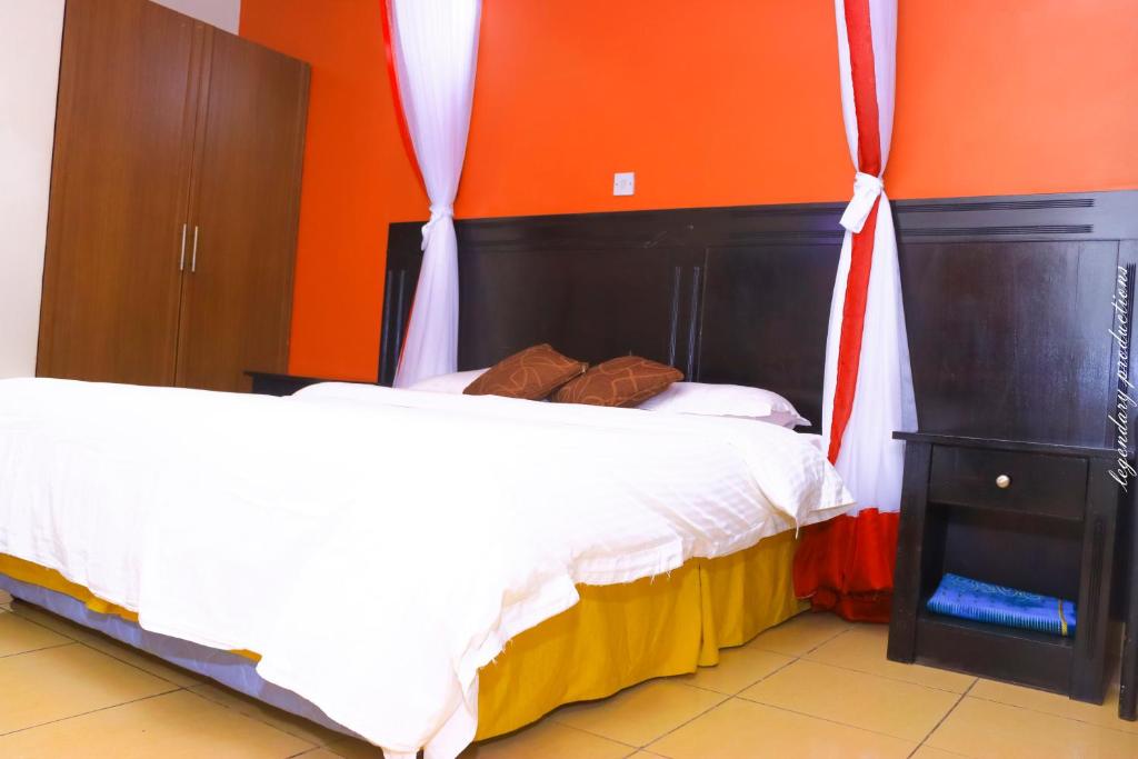 Postel nebo postele na pokoji v ubytování Jamia Central Hotel