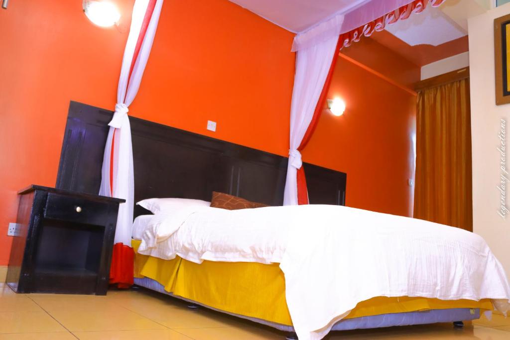 Postel nebo postele na pokoji v ubytování Jamia Central Hotel