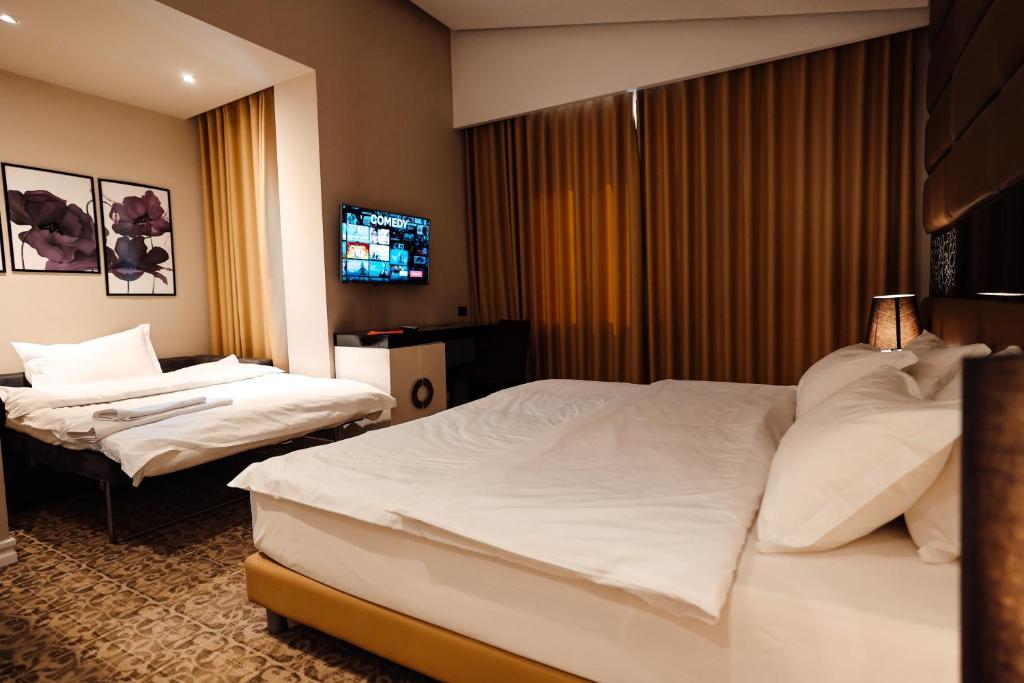 Letto o letti in una camera di Senator Hotel