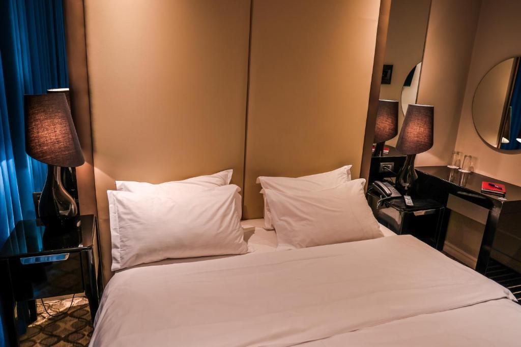 Letto o letti in una camera di Senator Hotel