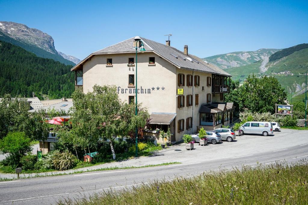 a large building on the side of a road at Hotel Le Faranchin in Villar-dʼArène