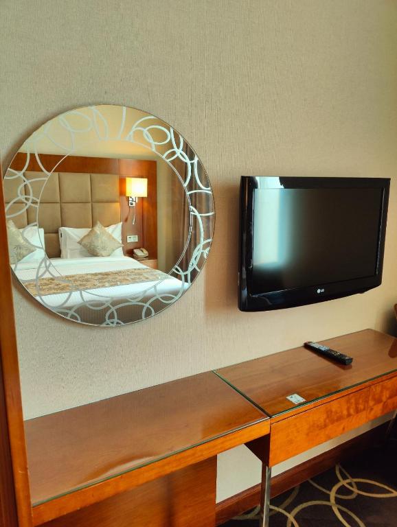 TV a/nebo společenská místnost v ubytování Montreal Barsha Hotel