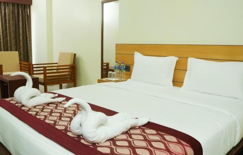 Postel nebo postele na pokoji v ubytování Urban Suites