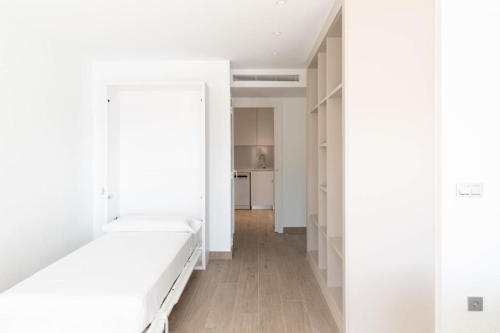 Postel nebo postele na pokoji v ubytování Loft amb vistes al mar by Apartaments La Catifa