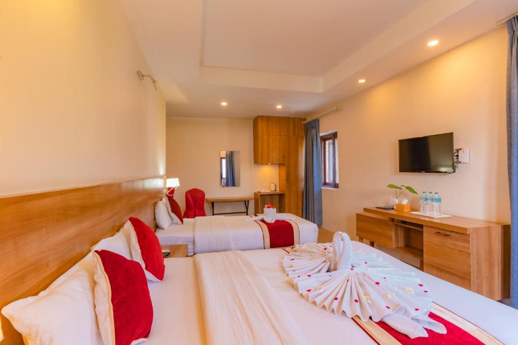 Postel nebo postele na pokoji v ubytování Siddhartha Resort, Chisapani