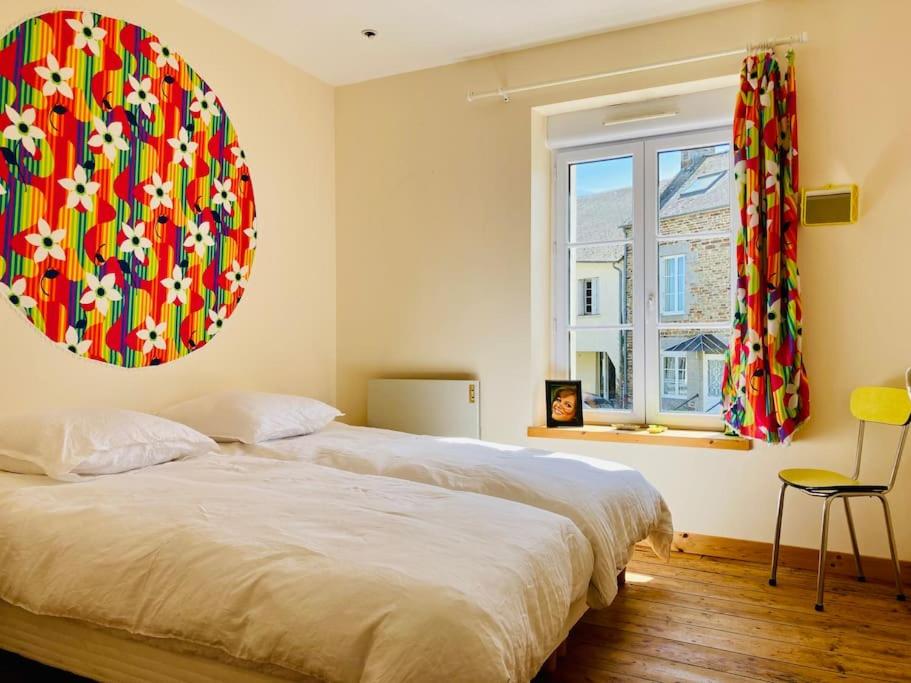 En eller flere senge i et værelse på Maison de village - MadreMia ! A proximité de Bagnoles de l'Orne