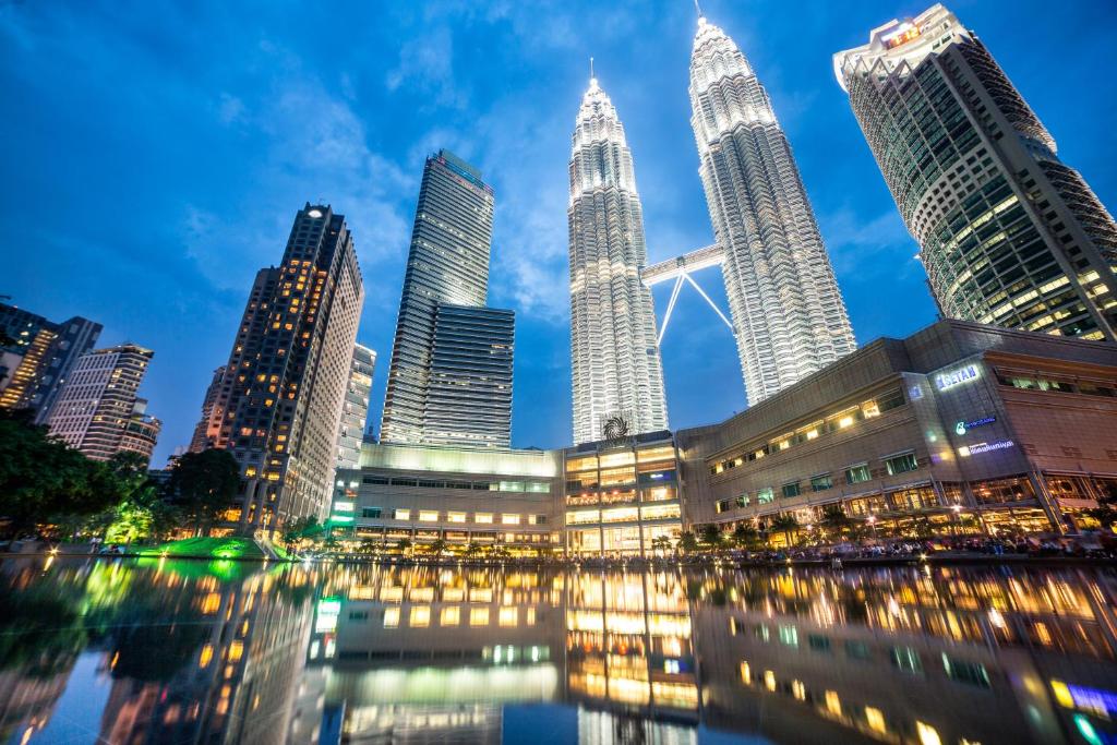 a view of a city skyline at night at Mandarin Oriental, Kuala Lumpur in Kuala Lumpur