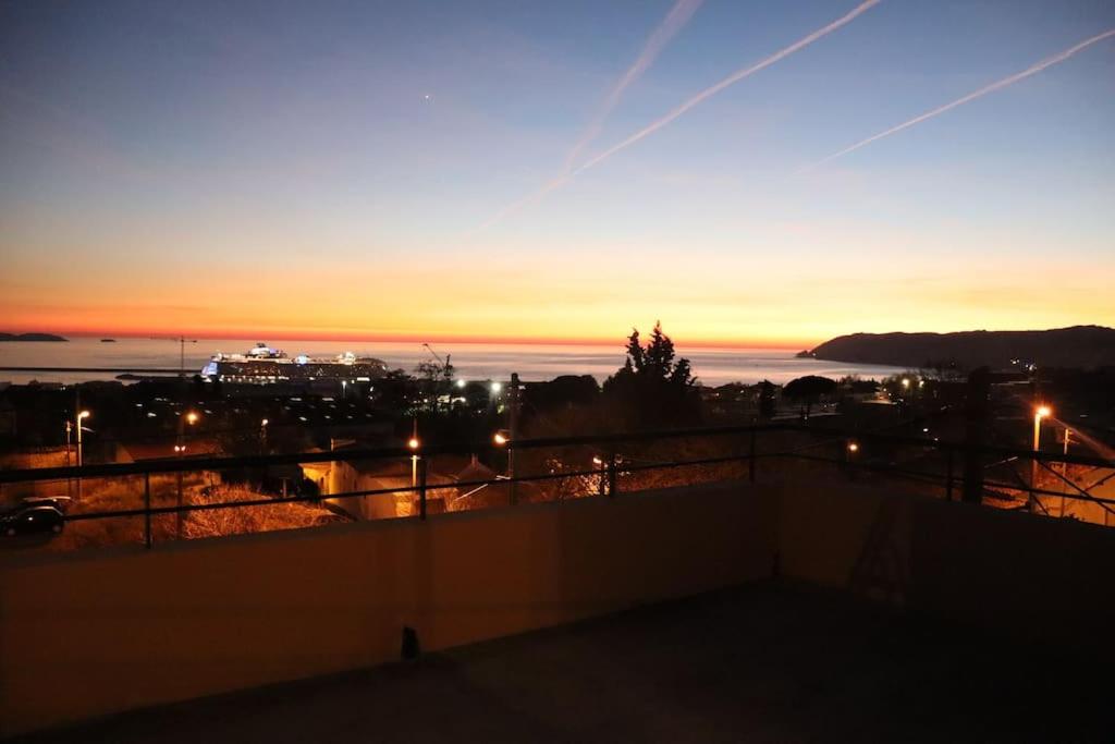 a view of the sunset from a rooftop at Estaque Cozy nest with a magical view of the sea in Marseille