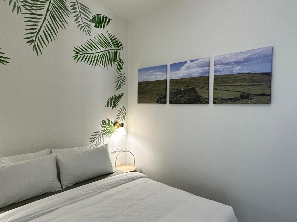Postel nebo postele na pokoji v ubytování WinXin House