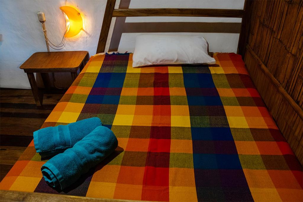 Postel nebo postele na pokoji v ubytování Hostal Olmito Canoa