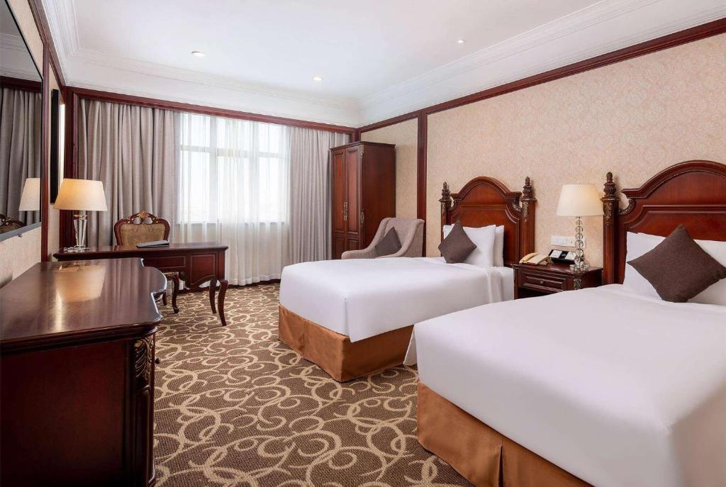 Postel nebo postele na pokoji v ubytování Wyndham Shanghai Hongqiao-Near NECC
