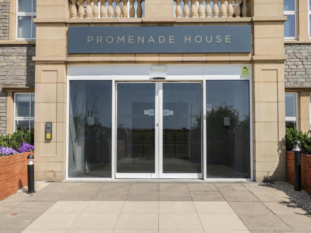 a entrance to a preparednsicsnsics house with glass doors at The Studio in Weston-super-Mare