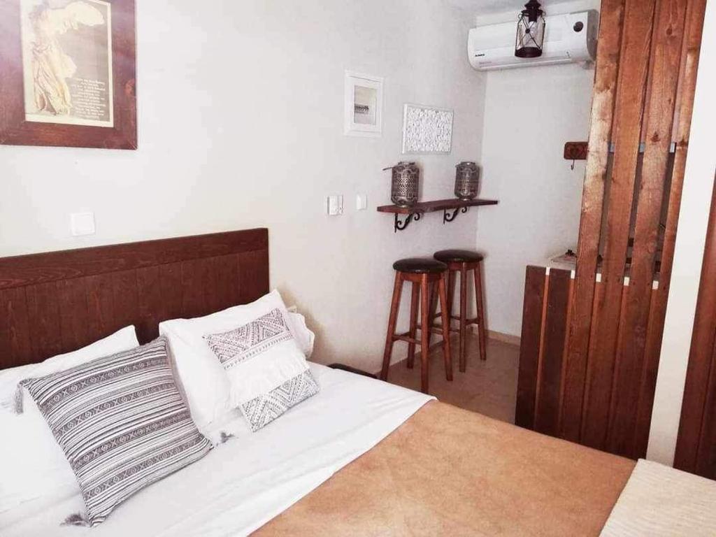 Postel nebo postele na pokoji v ubytování Guesthouse Axieros