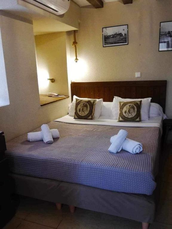 Postel nebo postele na pokoji v ubytování Guesthouse Axieros