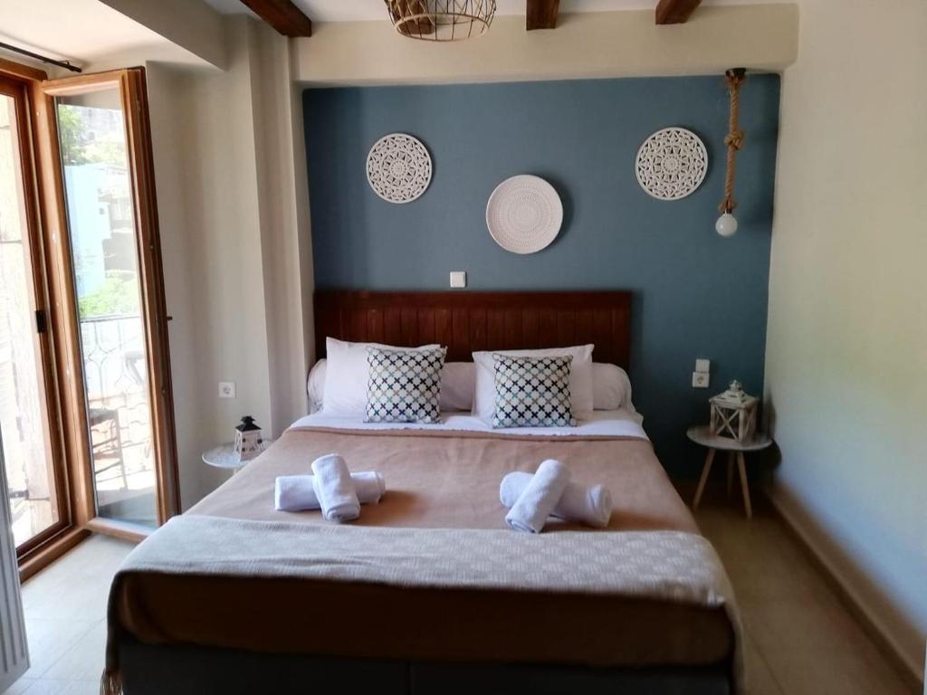 Postel nebo postele na pokoji v ubytování Guesthouse Axieros