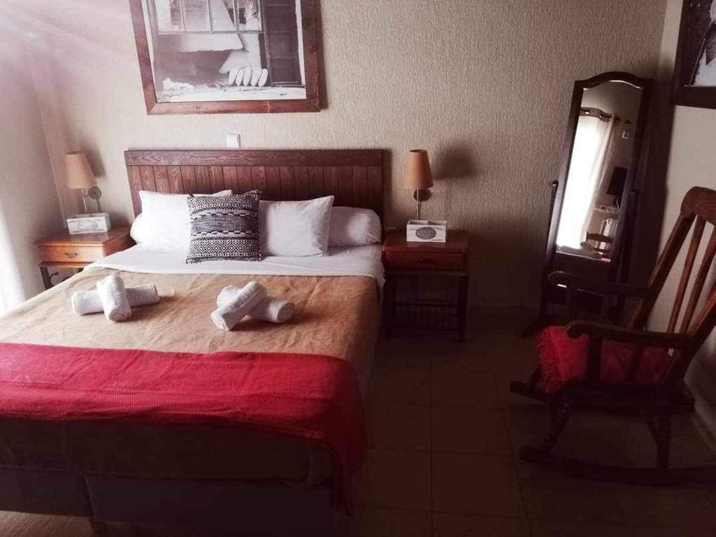 Postel nebo postele na pokoji v ubytování Guesthouse Axieros