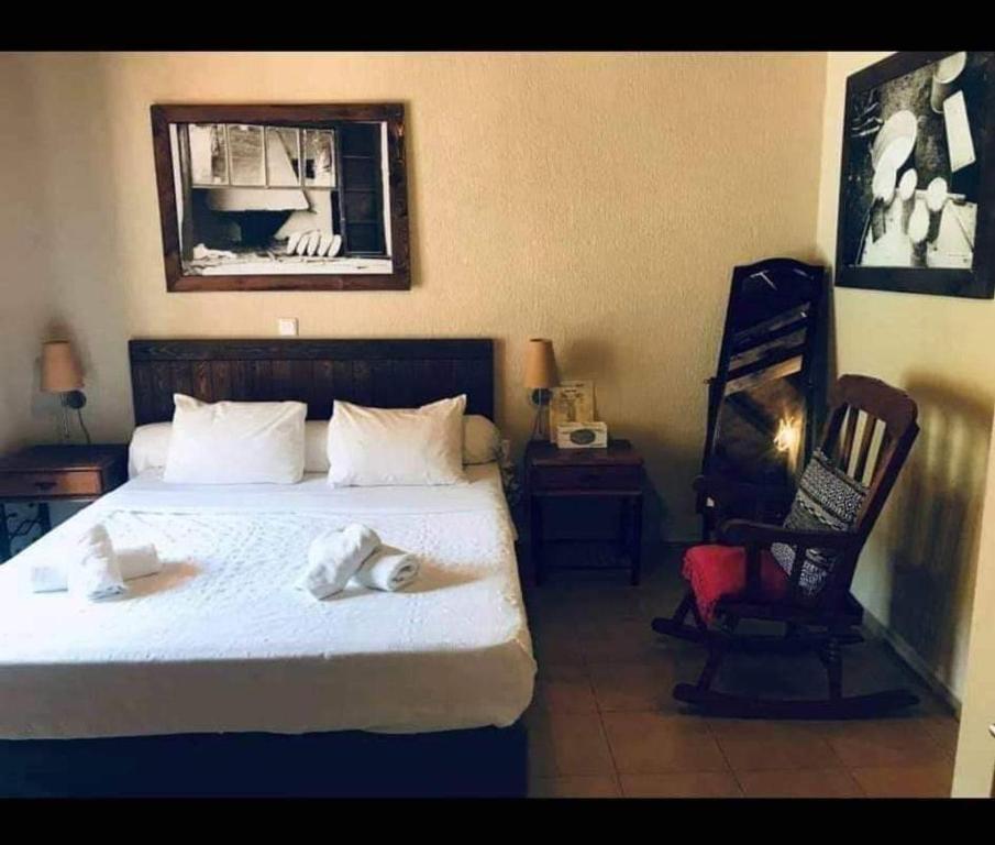 Postel nebo postele na pokoji v ubytování Guesthouse Axieros
