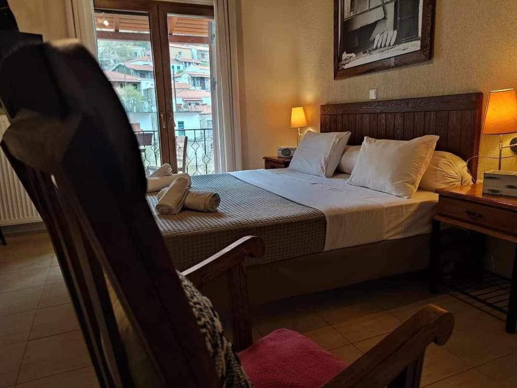 Postel nebo postele na pokoji v ubytování Guesthouse Axieros