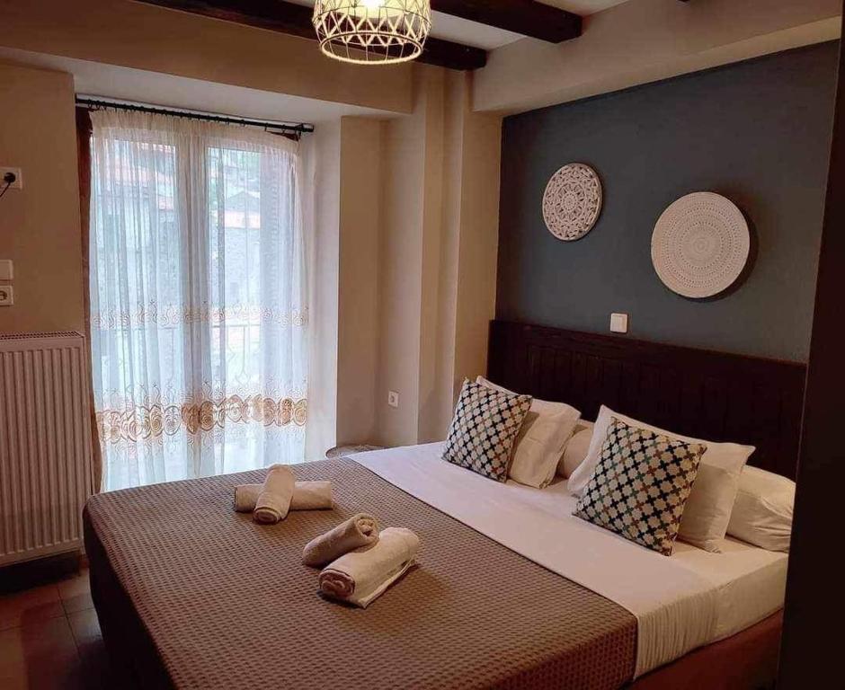 Postel nebo postele na pokoji v ubytování Guesthouse Axieros