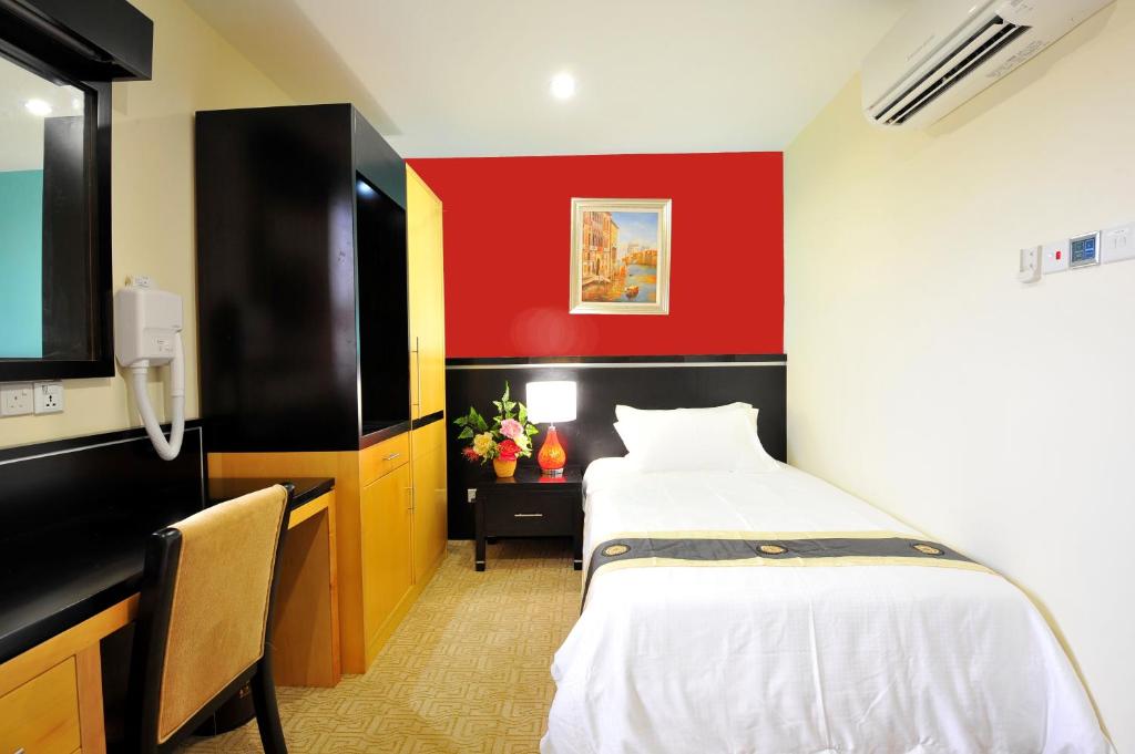 Postel nebo postele na pokoji v ubytování Grand Hallmark Hotel - Johor Bahru