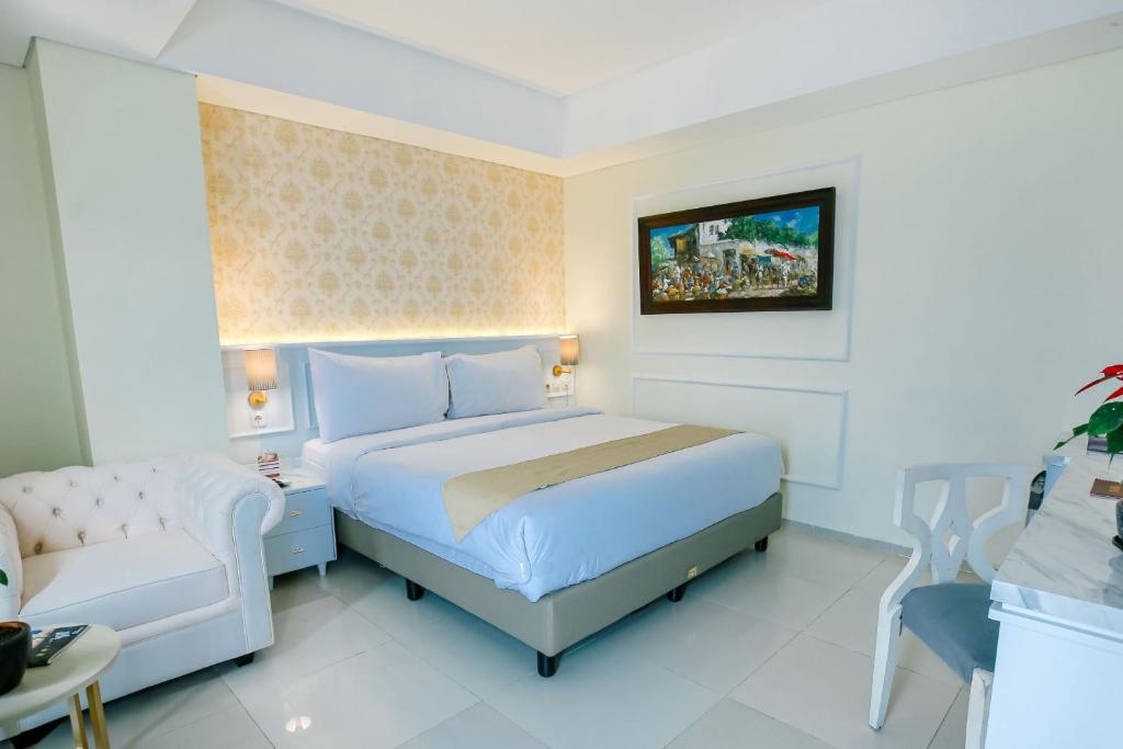 Postel nebo postele na pokoji v ubytování The Cube Hotel Malioboro, Azana Hotels Collection