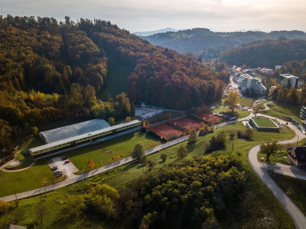 an aerial view of a building in a forest at GO! Sport hotel & resort in Rogaška Slatina