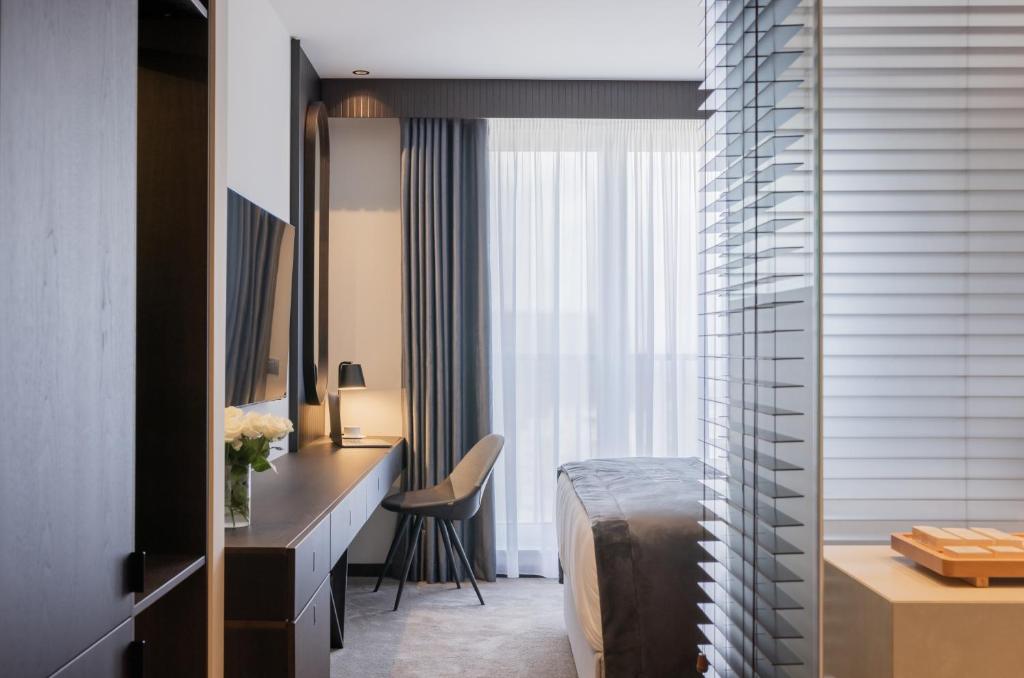 Postel nebo postele na pokoji v ubytování Derand Hotel