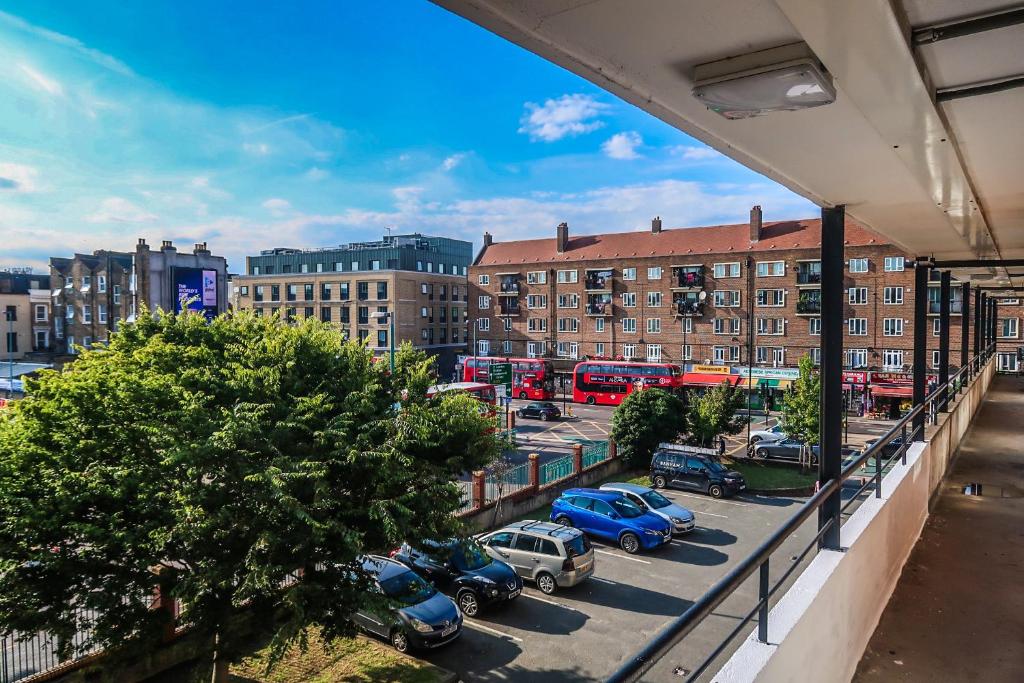 a view from a balcony of a parking lot with cars at Comfortable Room-Only Room in London