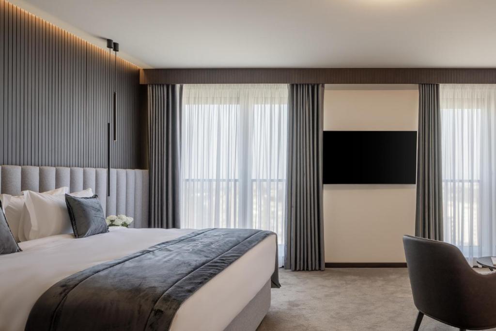 TV a/nebo společenská místnost v ubytování Derand Hotel