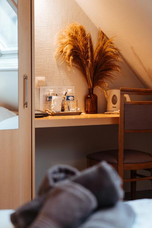 Postel nebo postele na pokoji v ubytování Hotel Brasserie De Beiaard