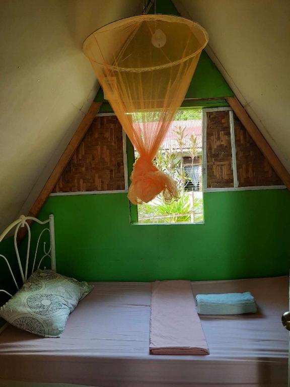 Postel nebo postele na pokoji v ubytování Lagkaw Uno in Lagkaw Homestay