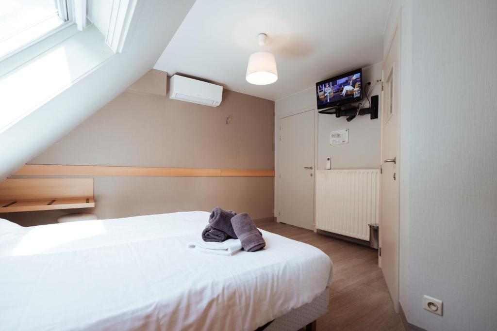 Postel nebo postele na pokoji v ubytování Hotel Brasserie De Beiaard