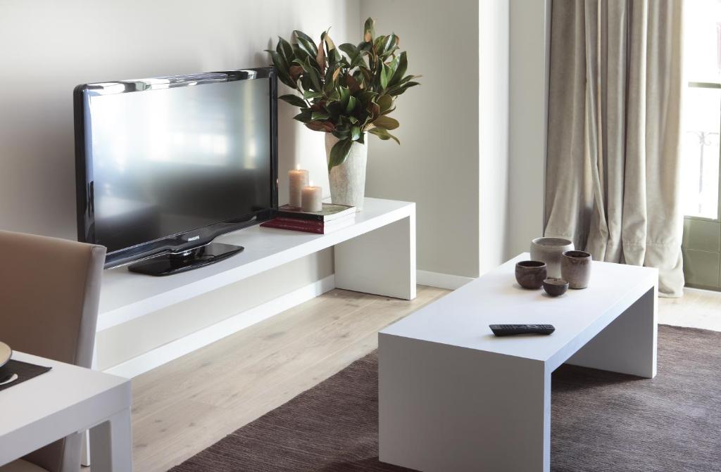 TV a/nebo společenská místnost v ubytování Rambla 102