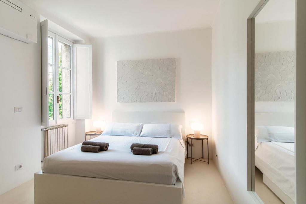 Postel nebo postele na pokoji v ubytování Giuliny Lovely Flat - The House Of Travelers