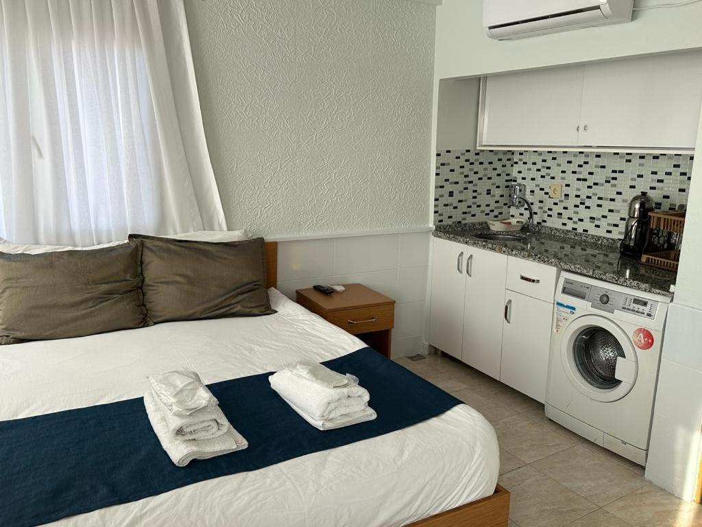 A bed or beds in a room at Güven House İstanbul