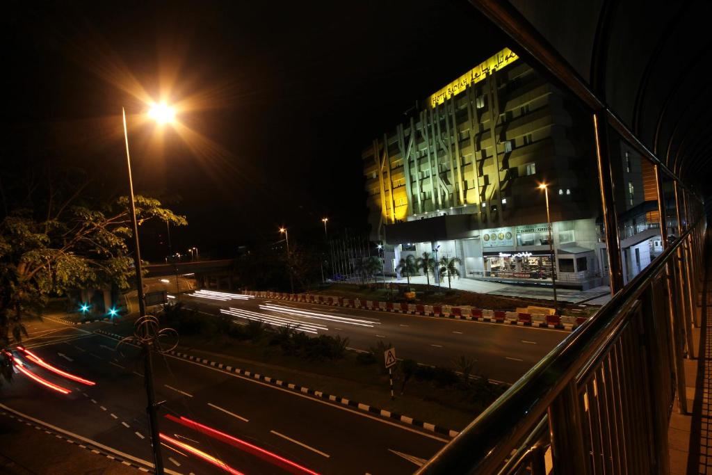 a view of a street at night with a building at Badi'ah Hotel in Bandar Seri Begawan
