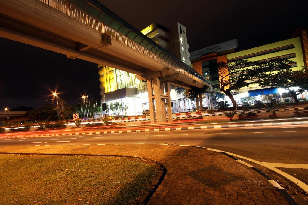 a city street at night with streaks of lights at Badi'ah Hotel in Bandar Seri Begawan