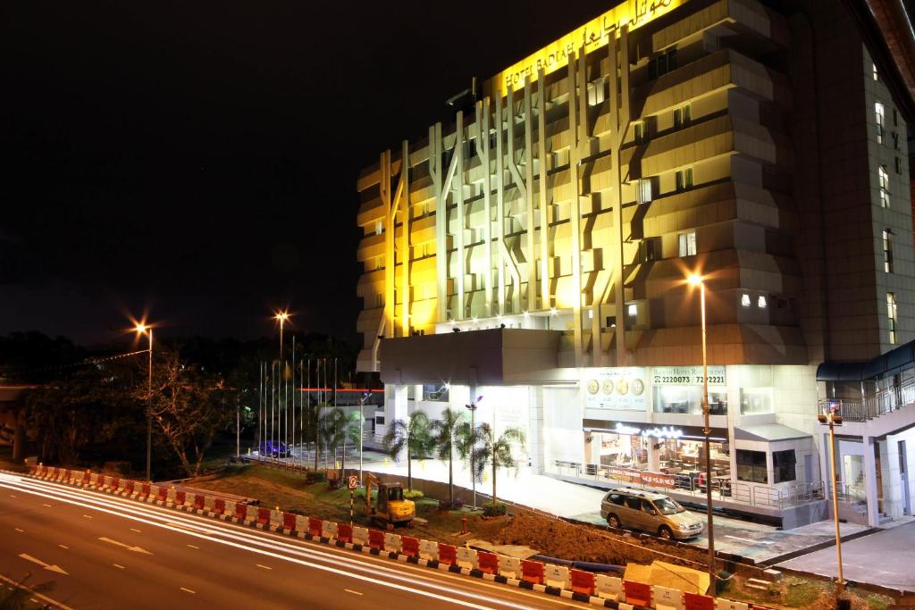 a building on a city street at night at Badi'ah Hotel in Bandar Seri Begawan