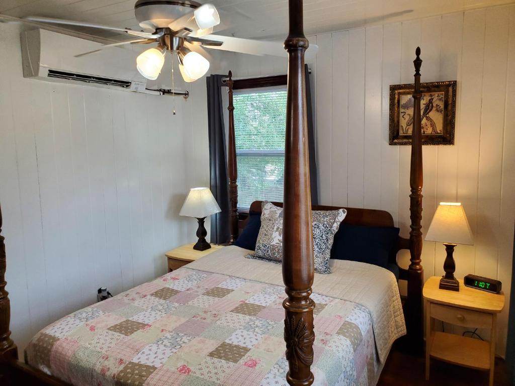 a bedroom with a bed and a ceiling fan at 3864 Walsh Street Apartment in Jacksonville