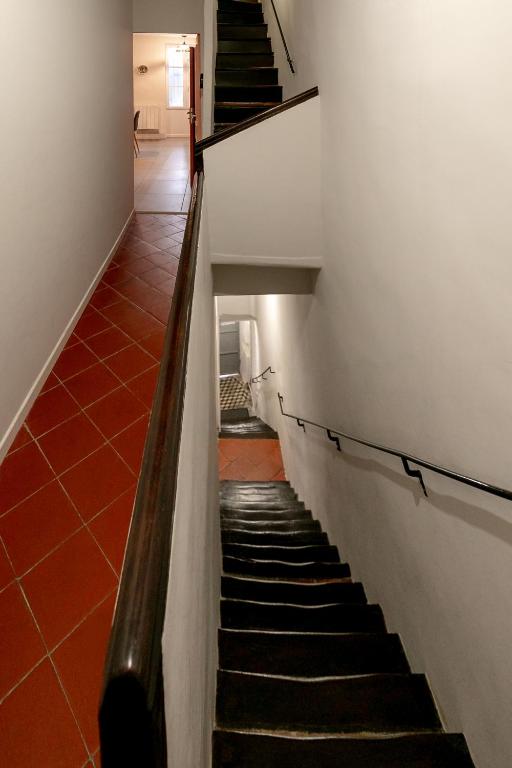 a hallway with a staircase in a building at Perpignan - Appartement en centre ville in Perpignan