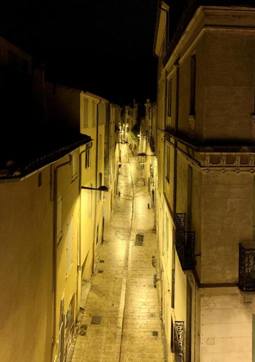 an empty street at night in a city at Perpignan - Appartement en centre ville in Perpignan