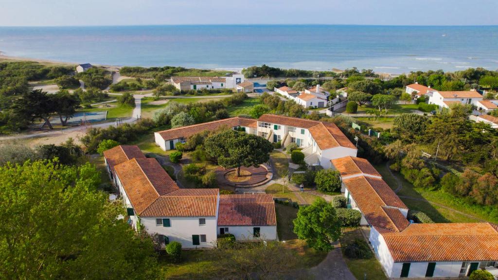 an aerial view of a house with the ocean at VVF Île de Ré Sainte-Marie-de-Ré in Sainte-Marie-de-Ré
