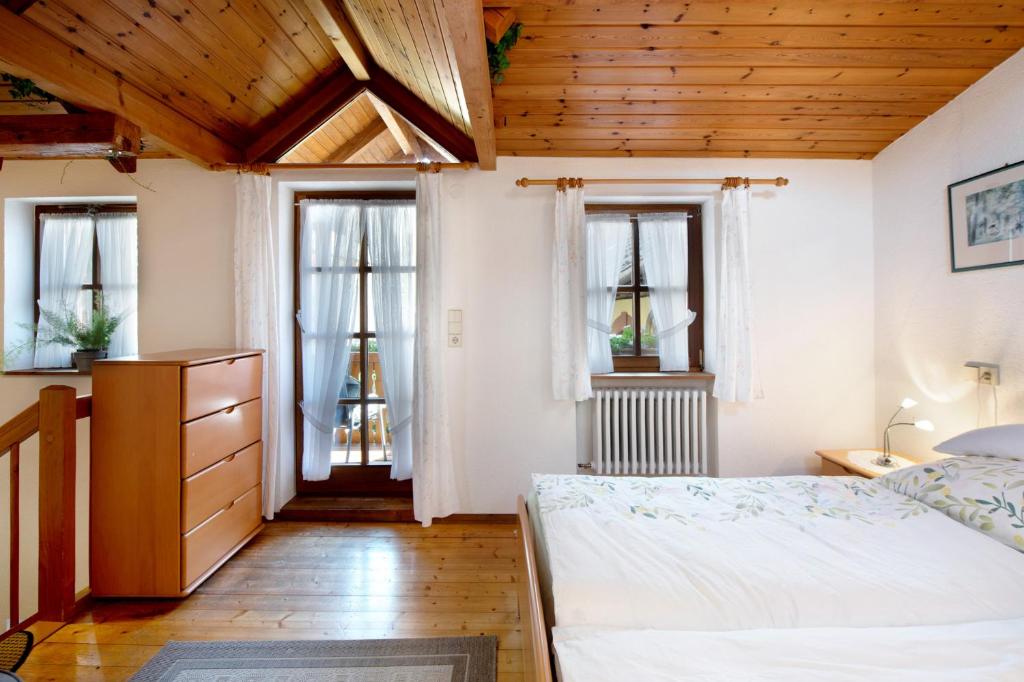 Postel nebo postele na pokoji v ubytování Romann