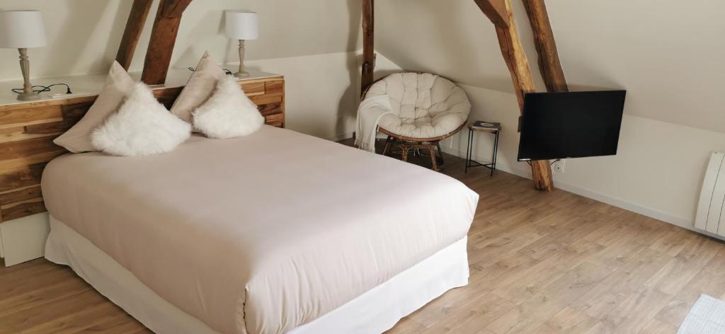 Ein Bett oder Betten in einem Zimmer der Unterkunft Les Bras de Morphée